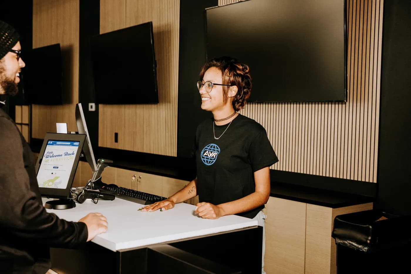 A budtender helping a customer at The Dispensary (Decatur)